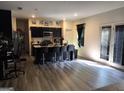 Open concept kitchen with a center island, modern stools, and stainless steel appliances at 99 Cooperton, Villa Rica, GA 30180