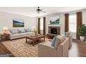 Cozy living room featuring a stone fireplace and comfortable furnishings at 1225 Polk Xing, Mcdonough, GA 30252