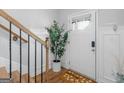 Inviting entryway with natural light, modern decor, and a charming 'Bee our guest' welcome mat at 445 Sawmill Trce, Hampton, GA 30228
