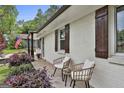 Cozy front porch with comfortable seating and beautiful landscaping at 306 N Meade Dr, Peachtree City, GA 30269