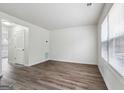 Spacious living room with new vinyl floors and ample natural light from a bright window at 4282 Worth Nw St, Acworth, GA 30101