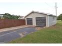 Detached two-car garage with a private driveway, offering ample parking and storage space for vehicles and equipment at 2647 Mount Carmel Rd, Hampton, GA 30228