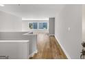 Spacious hallway with hardwood floors and natural light at 27 Lakes Edge Se Dr, Smyrna, GA 30080