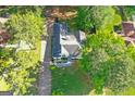 An aerial view of the property showing the home, driveway, and surrounding trees at 1291 Interlaken Pass, Jonesboro, GA 30238
