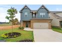 Charming two-story home with a well-manicured lawn and a two-car garage at 2385 Aukerman Trce # 80, Hampton, GA 30228