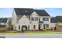 Attractive two-story home with a brick facade and well-maintained front yard at 1808 Quaker St, Hampton, GA 30228