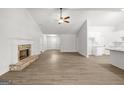 Spacious living room showcasing hard surface flooring and a brick fireplace at 3269 Broadnax Mill Rd # 1, Loganville, GA 30052