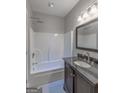 Neat bathroom featuring a shower-tub combination, granite countertop vanity, and modern fixtures at 59 S Old Hwy 27, Roopville, GA 30170