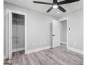 Spacious bedroom with modern ceiling fan, recessed lighting, and ample closet space at 5109 Dogwood Hills Dr, Sugar Hill, GA 30518