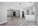 Open-concept living space features luxury vinyl plank floors and a seamless flow to the kitchen at 5109 Dogwood Hills Dr, Sugar Hill, GA 30518
