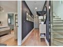 Inviting entryway with elegant decor, hardwood floors, and a view of the staircase at 145 Kelmscott Ln, Fayetteville, GA 30214