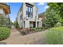 Stunning two-story home boasting a brick exterior, a private balcony, and beautifully landscaped surroundings at 145 Kelmscott Ln, Fayetteville, GA 30214
