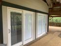 The exterior features sliding glass doors leading to an expansive outdoor space at 3255 Flat Shoals Sw Rd, Conyers, GA 30094