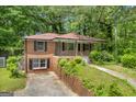 Two-story brick home with front-facing porch and driveway at 2531 Hood Nw Ave, Atlanta, GA 30318