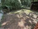 An outdoor backyard showing fence and greenery at 5552 Smithfield Rd, Bowdon, GA 30108