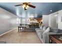 Spacious living room with a large sectional sofa and views into the kitchen at 5552 Smithfield Rd, Bowdon, GA 30108