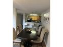 Cozy dining room with access to the kitchen and stylish seating for six at 45 Fieldview Ln, Covington, GA 30016