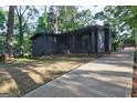 View of modern home with freshly cut grass and a concrete driveway at 1147 Tanglewood Rd, Jonesboro, GA 30236