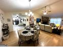 Open living space featuring a dining area, living room, and a fireplace at 104 Hillmont Dr, Woodstock, GA 30188