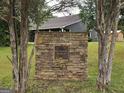 Stone sign for Bethany Ridge community, framed by mature trees at 10 Nicole Ct, Covington, GA 30016