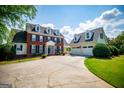 Charming brick home with black shutters, a covered entryway, and a manicured lawn in a suburban setting at 1745 Stripling Chapel Rd, Carrollton, GA 30116