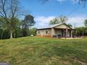 Spacious outbuilding with multiple garage doors and a covered porch at 3581 S Hwy 100, Bowdon, GA 30108