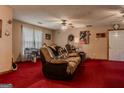 Comfortable living room with ceiling fan and sofa at 1170 Peeksville Rd, Locust Grove, GA 30248