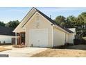 Back view of a single-Gathering home with a one-car garage at 351 Autumn Lake Dr, Mcdonough, GA 30253