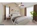 Comfortable bedroom features neutral tones, a large bed, and soft, natural lighting at 402 Sherrels Frd, Peachtree City, GA 30269