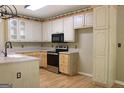 Functional kitchen with stainless appliances, wood cabinets, and ample counter space at 695 Frog Rd, Locust Grove, GA 30248