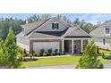 Beautiful single-Gathering home with brick, manicured lawn, and 2-car garage at 604 Parnassus Rd # 05, Locust Grove, GA 30248