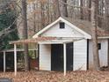 Outdoor shed with overhanging roof for storage at 309 Cornish Mountain Rd, Covington, GA 30014