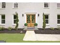 Beautiful entrance featuring double doors, greenary, and tasteful plantings at 400 Walnut Grove Rd, Peachtree City, GA 30269