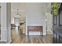 Open foyer showing seamless flow into living area with natural light and wood floors at 215 Murphy Creek Ln, Fayetteville, GA 30215
