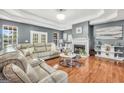 Inviting living room with a fireplace and lots of natural light at 70 Lake Charles Xing, Covington, GA 30016