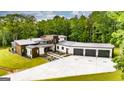 Stunning home showcasing modern architecture, a spacious driveway, and lush landscaping at 159 Sims Rd, Tyrone, GA 30290