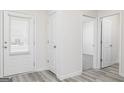 Bright hallway with a door to the outside and wood-look flooring at 435 Prescott Way, Villa Rica, GA 30180