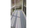 An inviting front porch with gray wood planks and elegant wrought iron railings at 2477 Briar Valley Way, Dacula, GA 30019