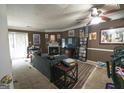 Living area featuring a fireplace, a ceiling fan, and comfortable seating at 3191 Kingswood Gln, Decatur, GA 30034