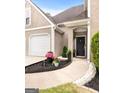 Inviting front entrance with meticulous landscaping and a well-maintained walkway at 150 Rockspray Rdg, Peachtree City, GA 30269