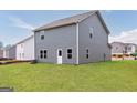 Spacious backyard with a lush green lawn, ideal for outdoor activities and relaxation at 285 Limestone Circle, Conyers, GA 30013