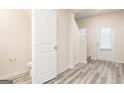 Well-lit hallway with modern vinyl flooring, offering a clean and inviting entrance at 285 Limestone Circle, Conyers, GA 30013