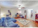 Open-concept living room with versatile space for work and relaxation at 75 Grady Smith St, Grantville, GA 30220