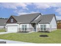 Traditional home with a spacious front yard, attached garage, and neutral color palette at 539 Cantrell Drive, Dallas, GA 30157