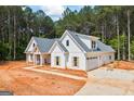 New home featuring white exterior, a gray roof, an attached garage and a concrete driveway at 4751 H D Atha Rd, Covington, GA 30014