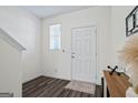 Welcoming foyer featuring dark wood floors and white walls with door to living area at 109 Feeney Lane, Villa Rica, GA 30180