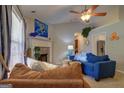 Cozy living room features a brick fireplace, comfortable seating, and inviting decor at 254 Roberts Trl, Locust Grove, GA 30248
