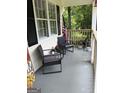 Cozy porch area with chairs and decor at 60 Carriage Gate Dr, Sharpsburg, GA 30277