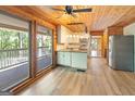 Bright kitchen with access to the deck, featuring granite countertops, stainless steel appliances, and ample natural light at 1597 Leguin Mill Rd, Locust Grove, GA 30248