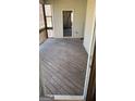 View of Screened Porch with wooden floor, in need of repair at 8828 Patricia Rose, Douglasville, GA 30134